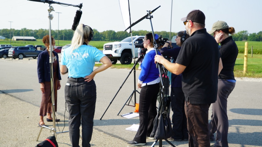 The crew filming an interview outdoors at Pickaway Correctional Institution.